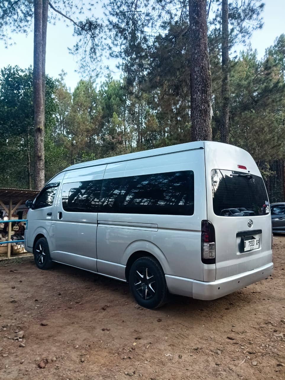 White Toyota Hiace Commuter minibus parked at tourist destination